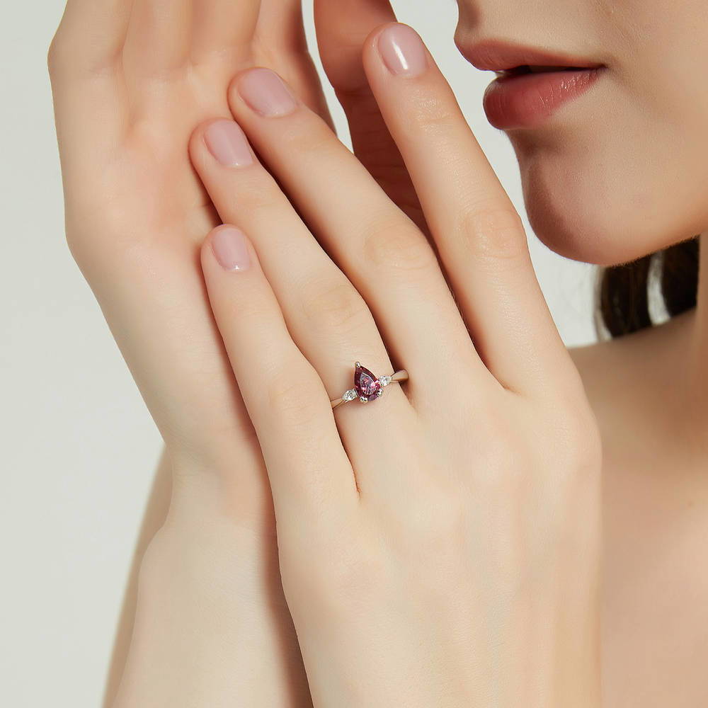 Model wearing 3-Stone Red Pear CZ Ring in Sterling Silver
