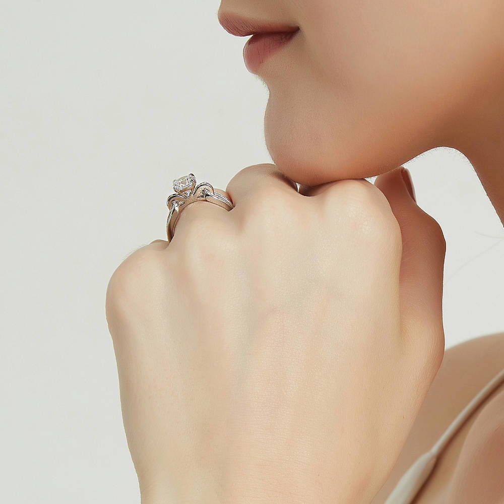 Model wearing Solitaire Interlocking 1.25ct Round CZ Ring in Sterling Silver