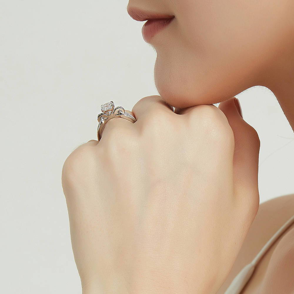 Model wearing Solitaire Interlocking 1.25ct Round CZ Ring in Sterling Silver, 7 of 9