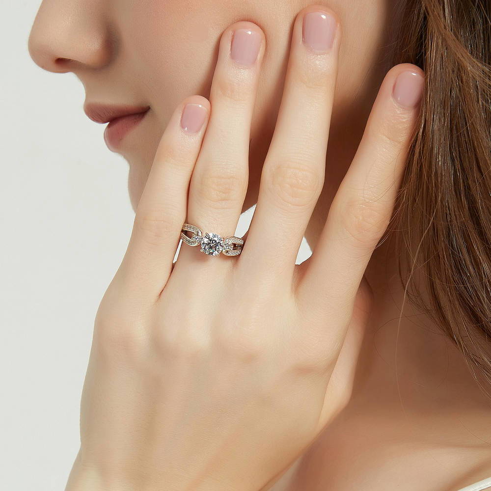 Model wearing Solitaire Interlocking 1.25ct Round CZ Ring in Sterling Silver, 2 of 9