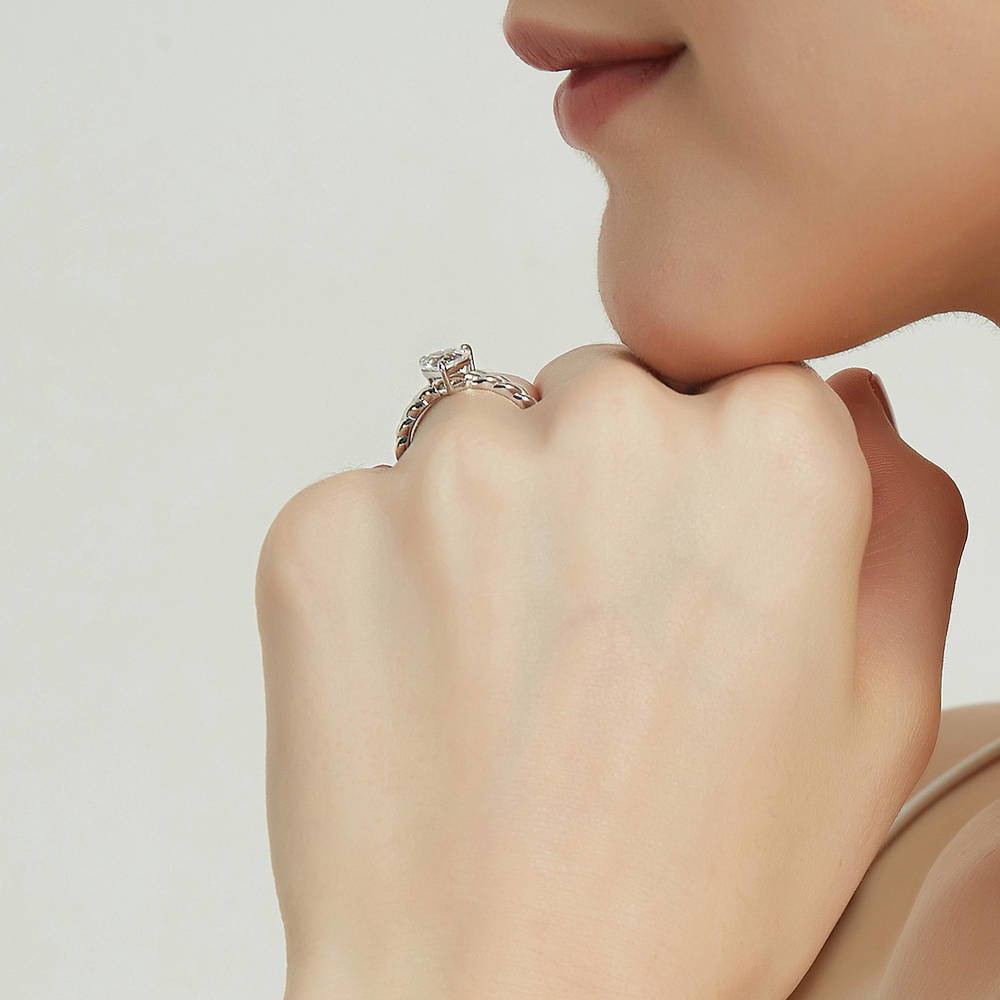 Model wearing Woven Solitaire CZ Ring in Sterling Silver