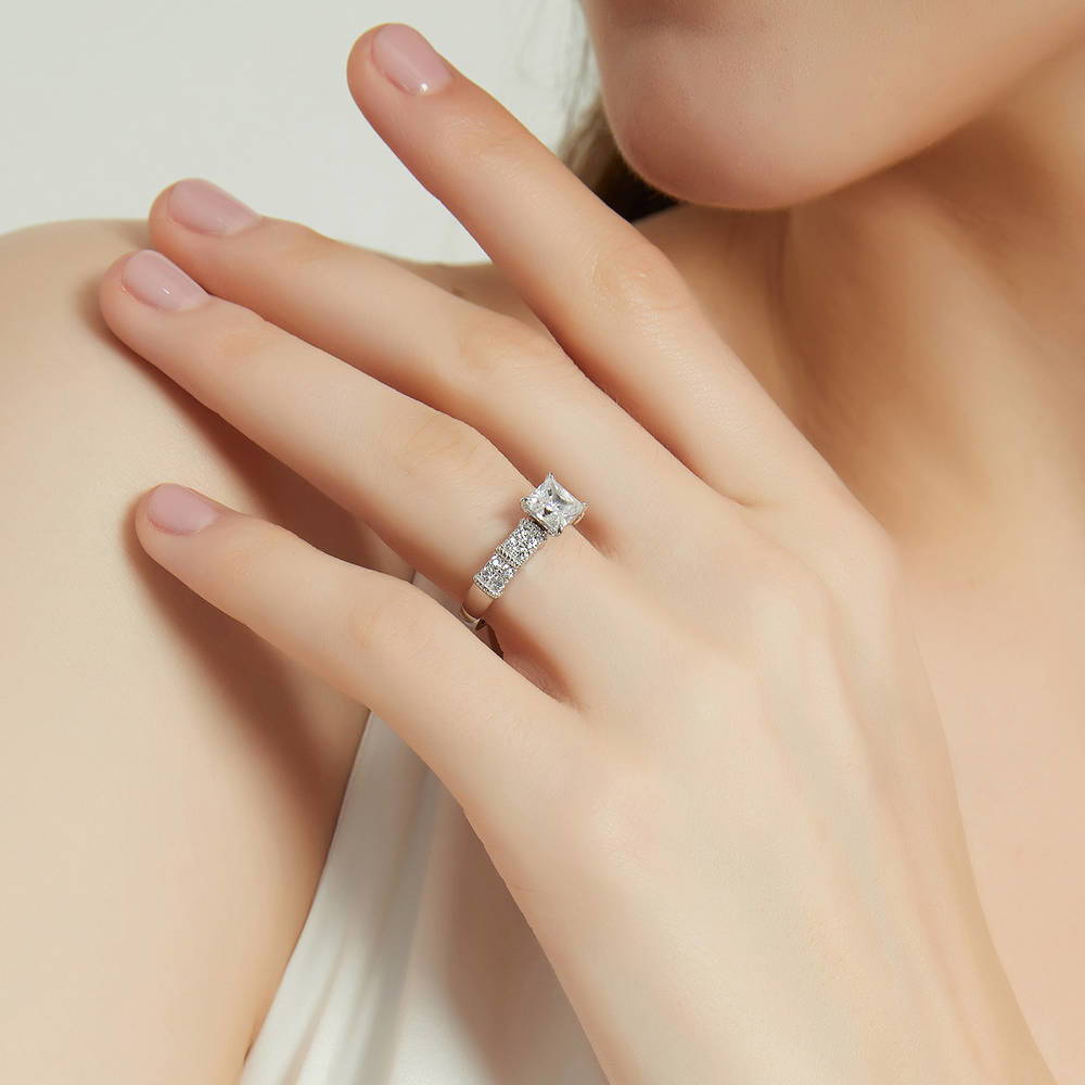 Model wearing Solitaire 1.2ct Princess CZ Ring in Sterling Silver, 3 of 9