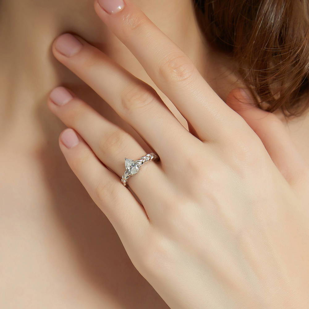 Model wearing Solitaire Woven 1ct Pear CZ Ring Set in Sterling Silver, 2 of 13