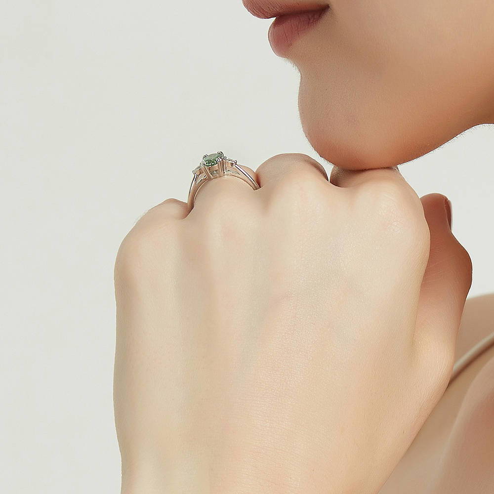 Model wearing 3-Stone Green Oval CZ Ring in Sterling Silver, 7 of 9