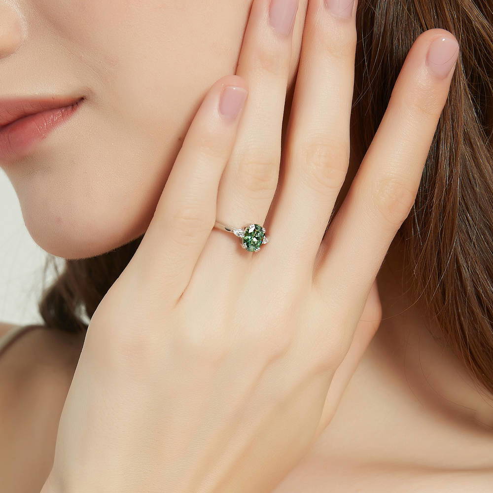 Model wearing 3-Stone Green Oval CZ Ring in Sterling Silver, 2 of 9