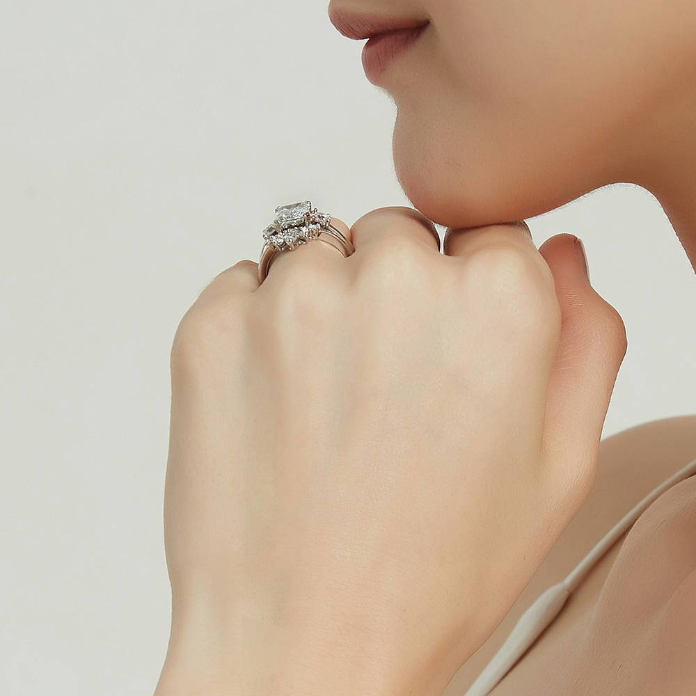 Model wearing 3-Stone 7-Stone Emerald Cut CZ Ring Set in Sterling Silver
