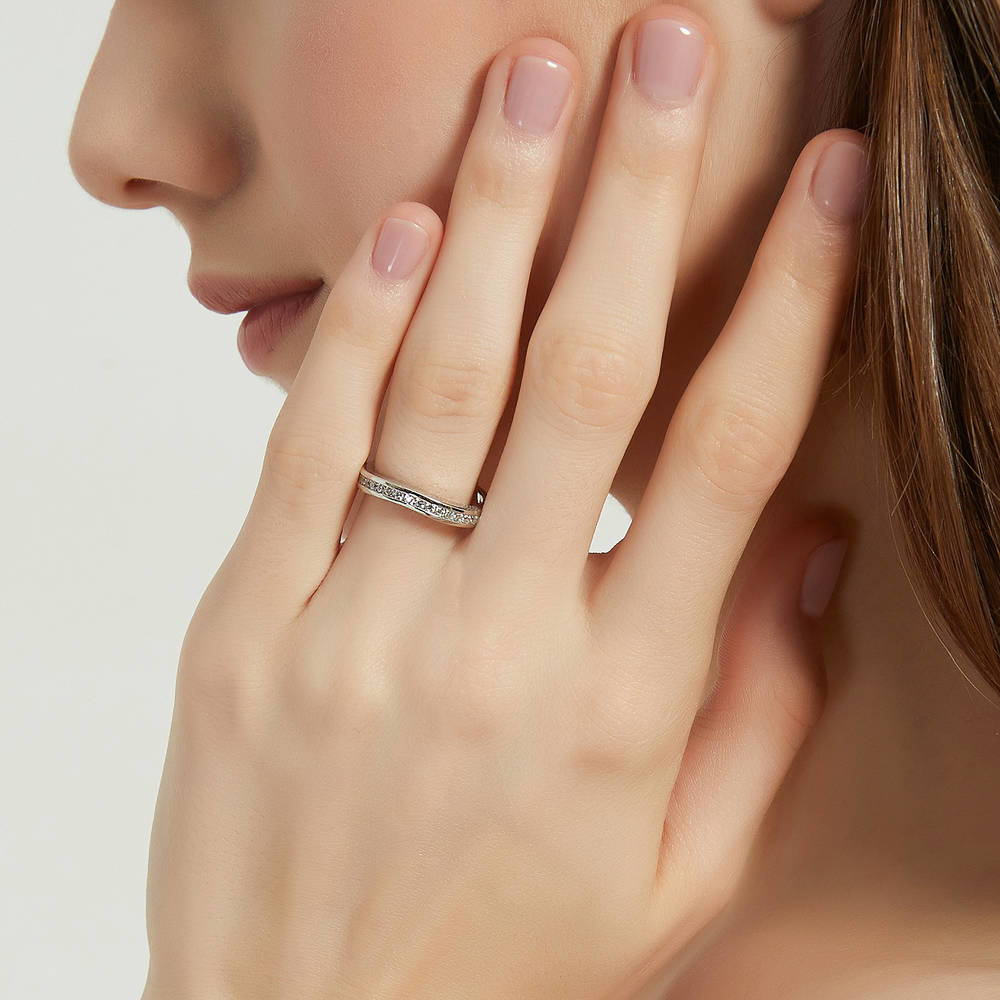 Model wearing Channel Set CZ Curved Half Eternity Ring in Sterling Silver