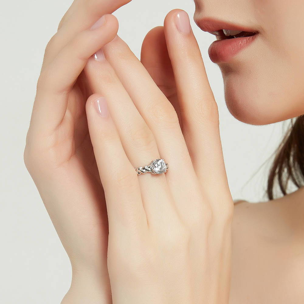 Model wearing Solitaire Woven 1.25ct Round CZ Ring Set in Sterling Silver, 10 of 17