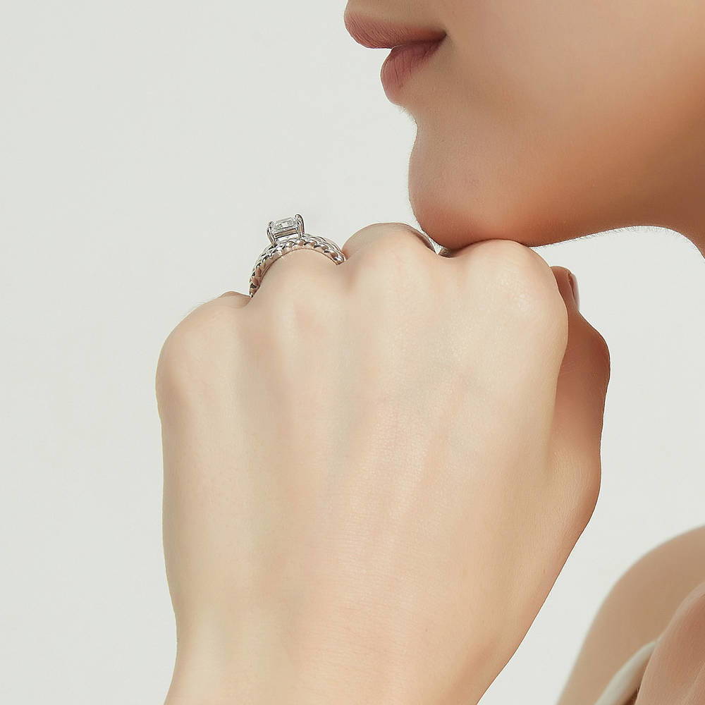 Model wearing Solitaire Woven 1.2ct Princess CZ Ring Set in Sterling Silver