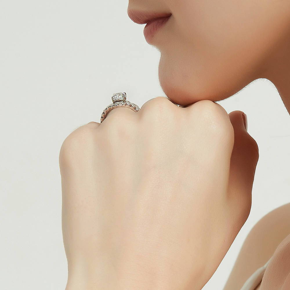 Model wearing Solitaire Woven 1.25ct Round CZ Ring Set in Sterling Silver