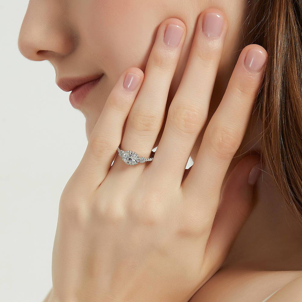 Model wearing 3-Stone Oval CZ Ring in Sterling Silver