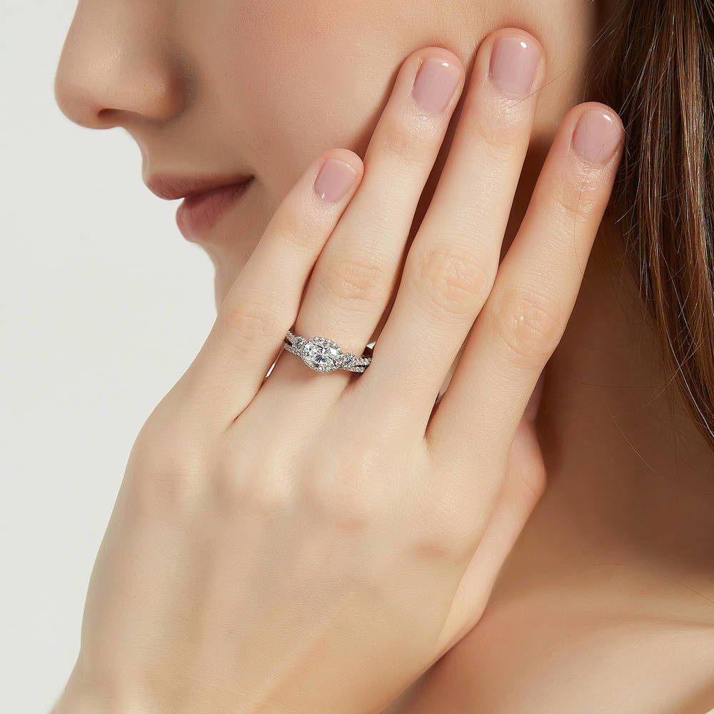 Model wearing 3-Stone Oval CZ Ring Set in Sterling Silver