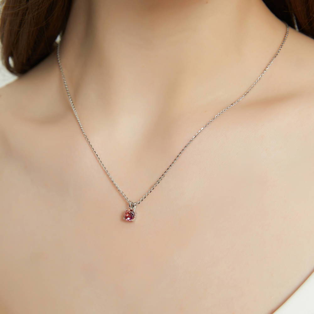 Model wearing Kaleidoscope Solitaire 0.8ct CZ Necklace in Sterling Silver, Red Orange Color