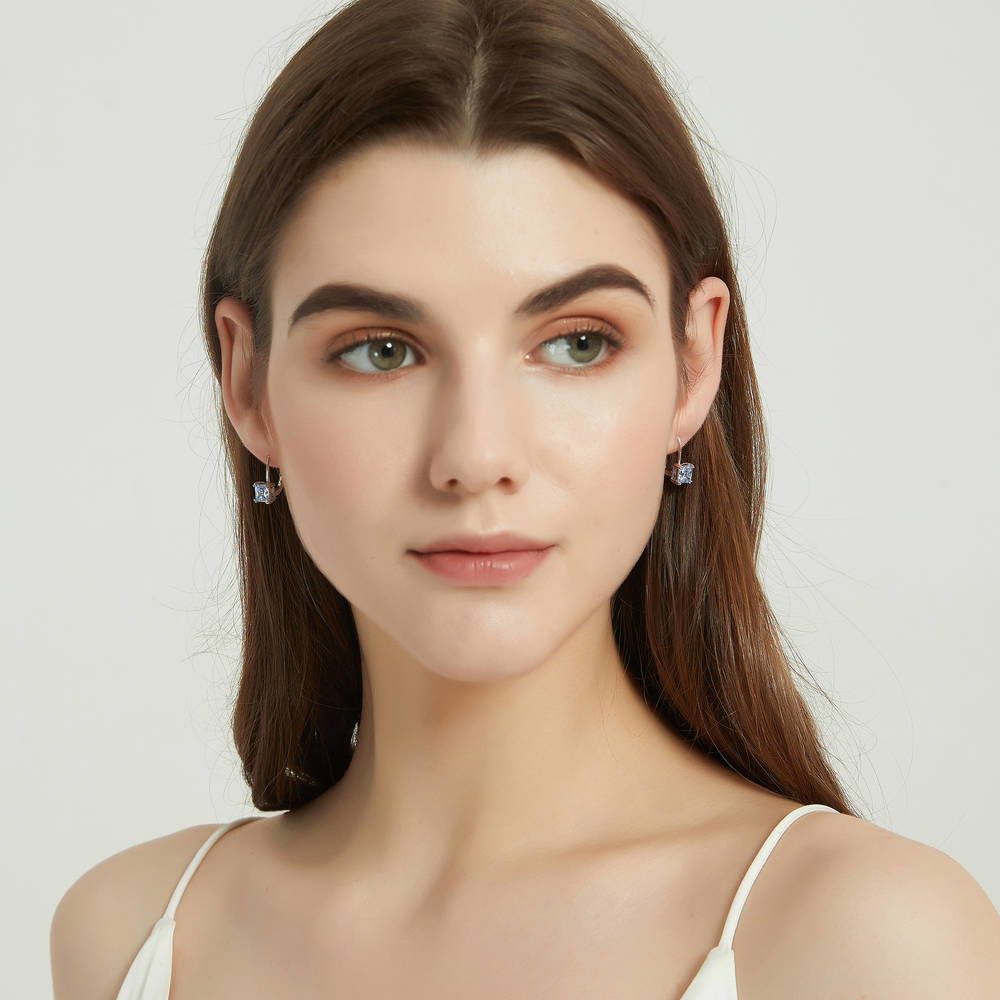 Model wearing Solitaire Princess CZ Leverback Earrings in Sterling Silver 2.4ct