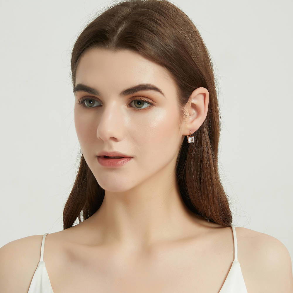 Model wearing Solitaire 4ct Princess CZ Leverback Dangle Earrings in Sterling Silver