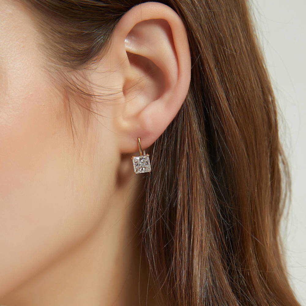 Model wearing Solitaire 4ct Princess CZ Leverback Dangle Earrings in Sterling Silver