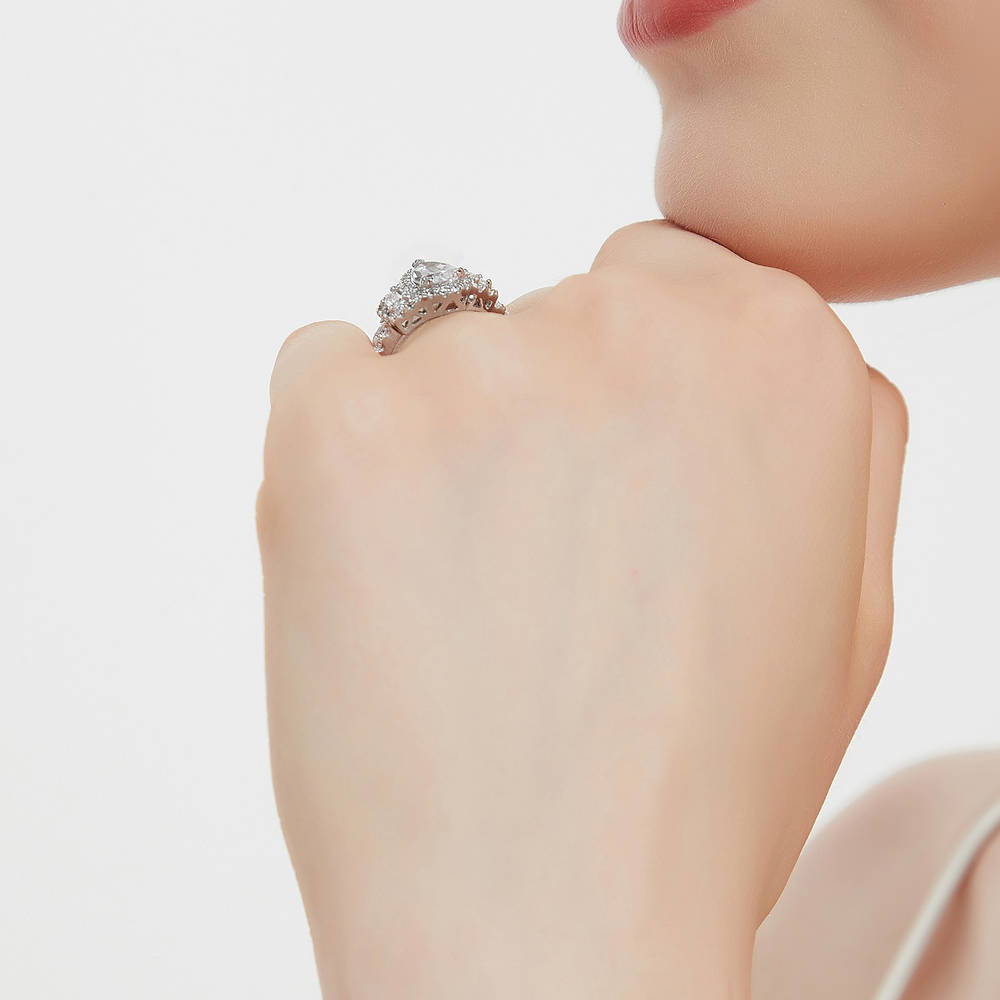 Model wearing 3-Stone Halo Pear CZ Ring in Sterling Silver