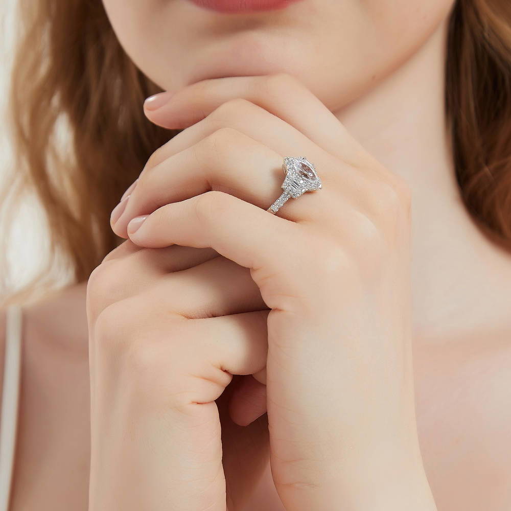 Model wearing 3-Stone Halo Marquise CZ Ring in Sterling Silver