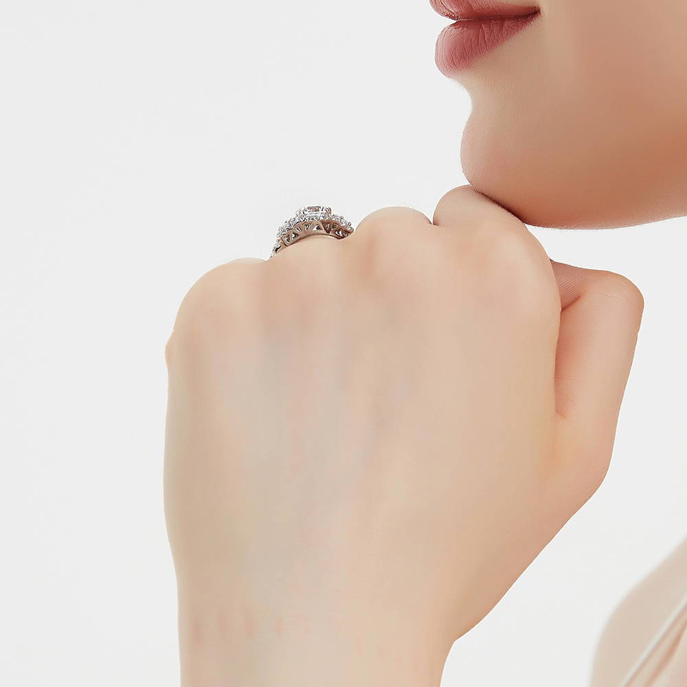 Model wearing 3-Stone Halo Round CZ Ring in Sterling Silver