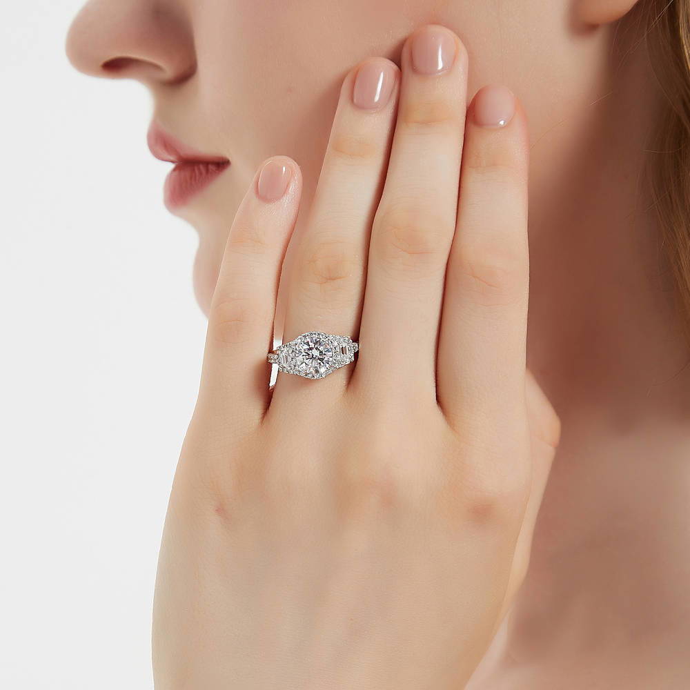 Model wearing 3-Stone Halo Round CZ Ring in Sterling Silver