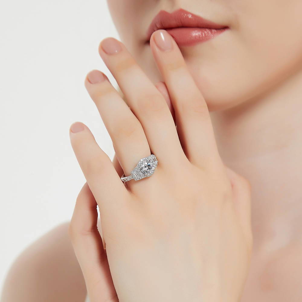 Model wearing 3-Stone Halo Round CZ Ring in Sterling Silver