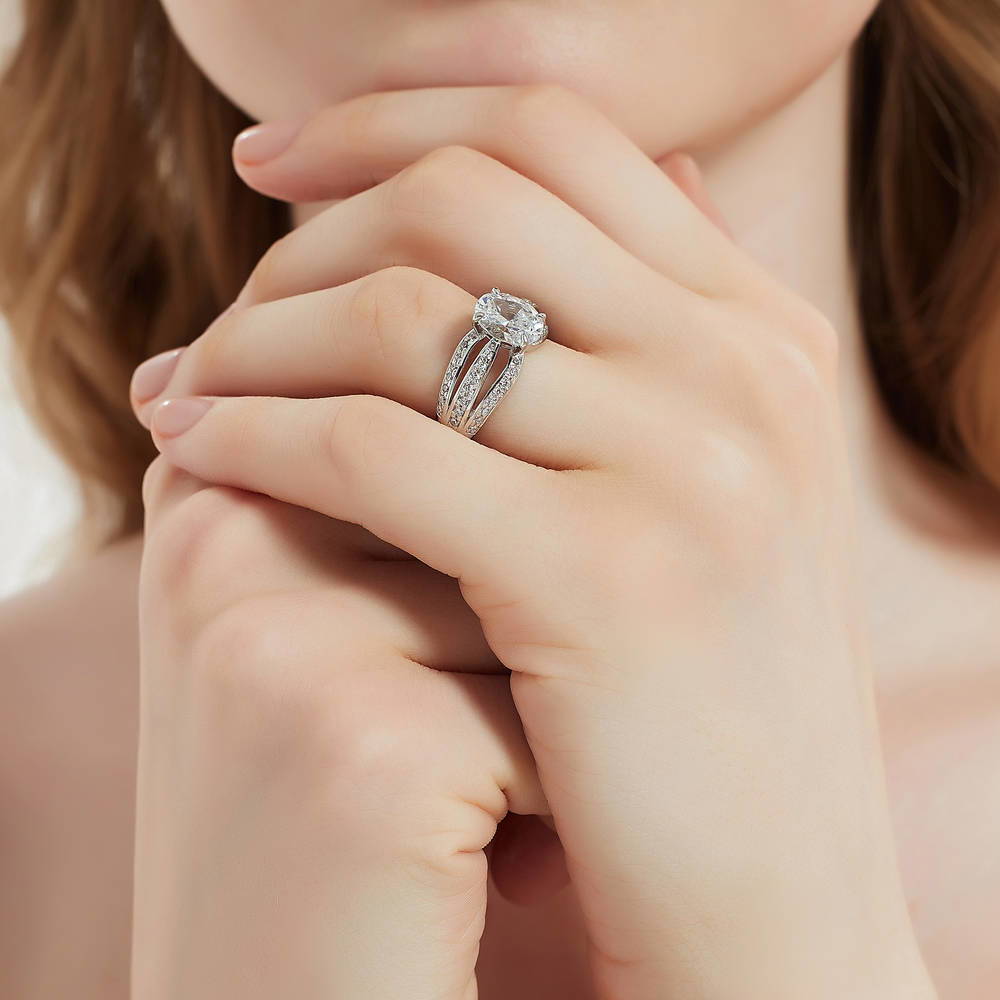 Model wearing Solitaire 1.8ct Oval CZ Ring in Sterling Silver, 6 of 9
