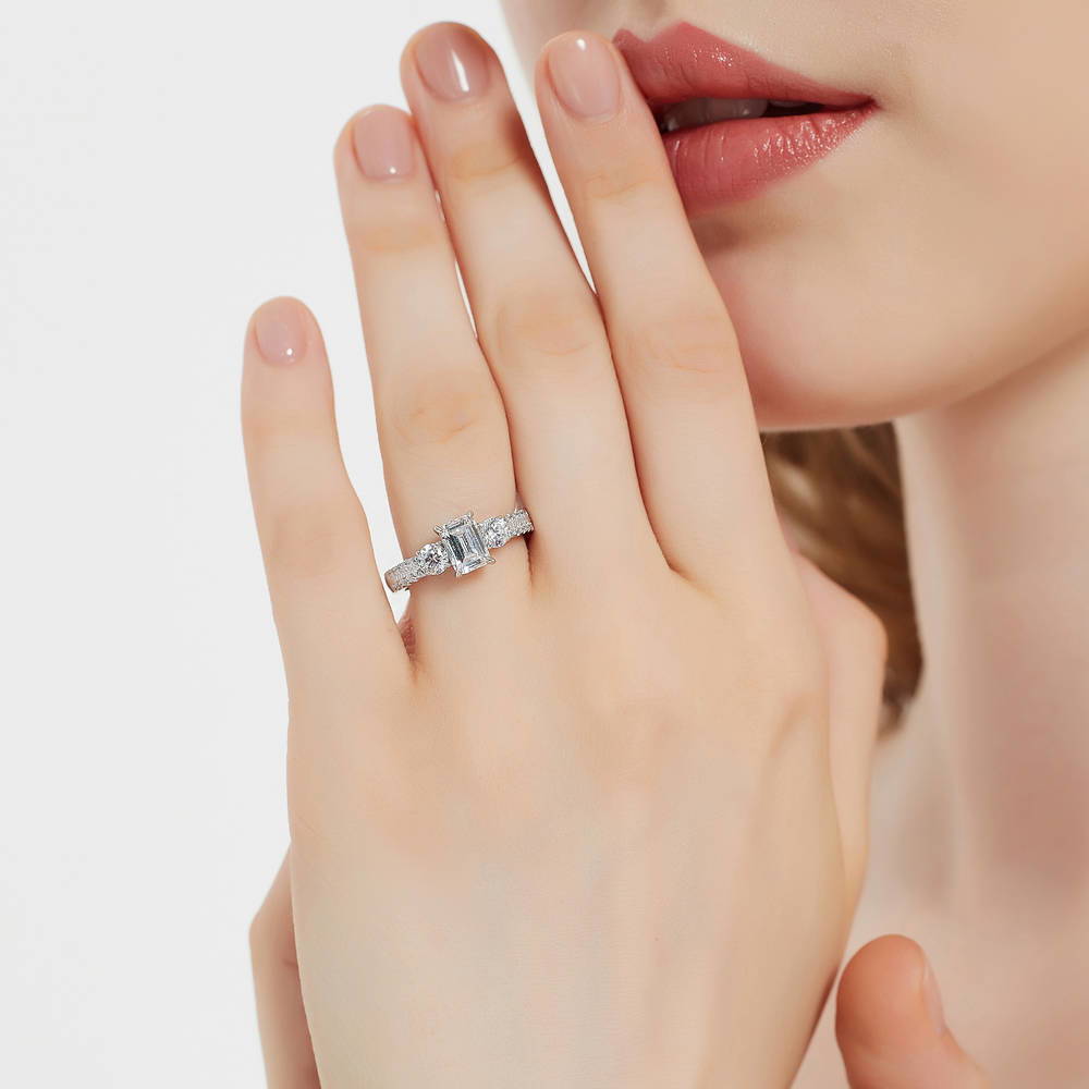 Model wearing 3-Stone Emerald Cut CZ Ring in Sterling Silver