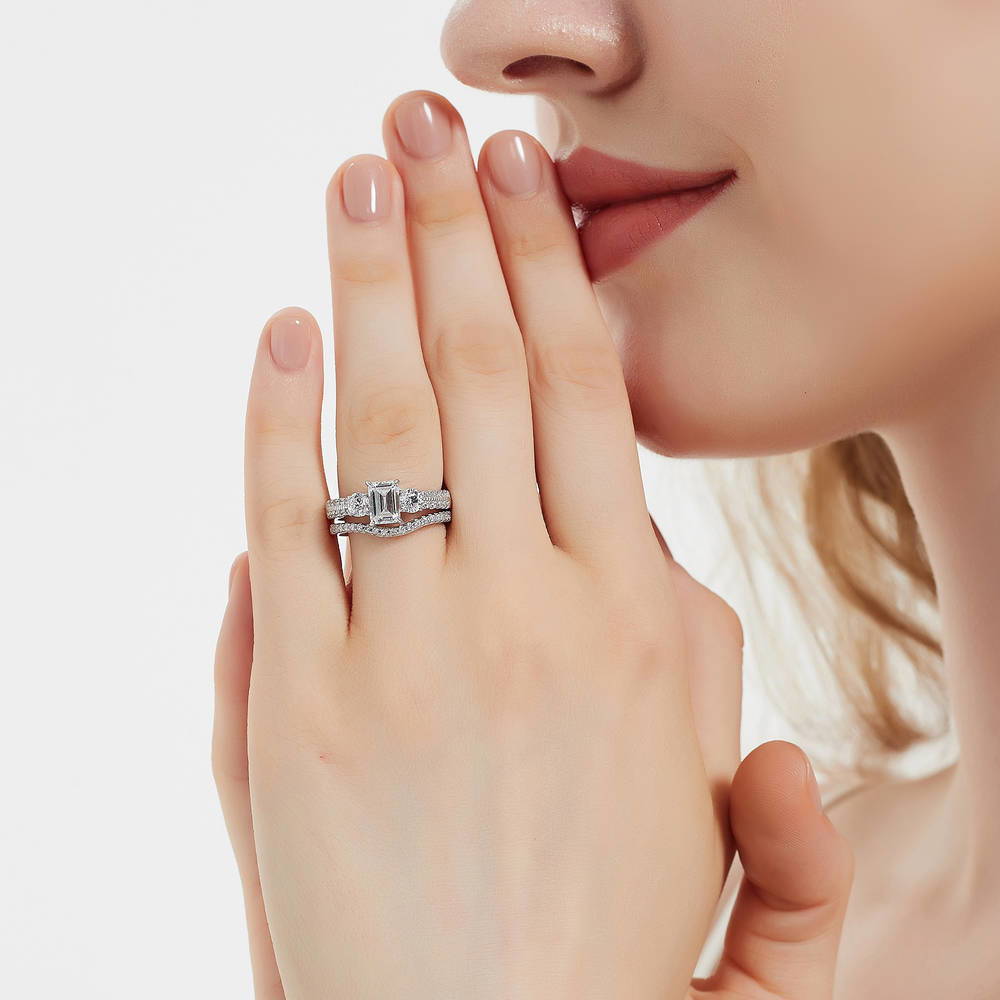 Model wearing 3-Stone Emerald Cut CZ Ring Set in Sterling Silver