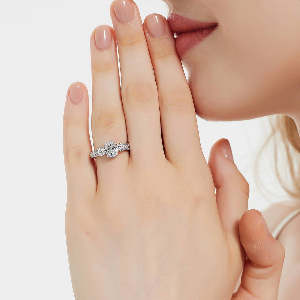 Model wearing 3-Stone Oval CZ Ring in Sterling Silver