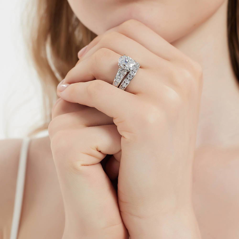 Model wearing Solitaire 2.5ct Oval CZ Ring Set in Sterling Silver