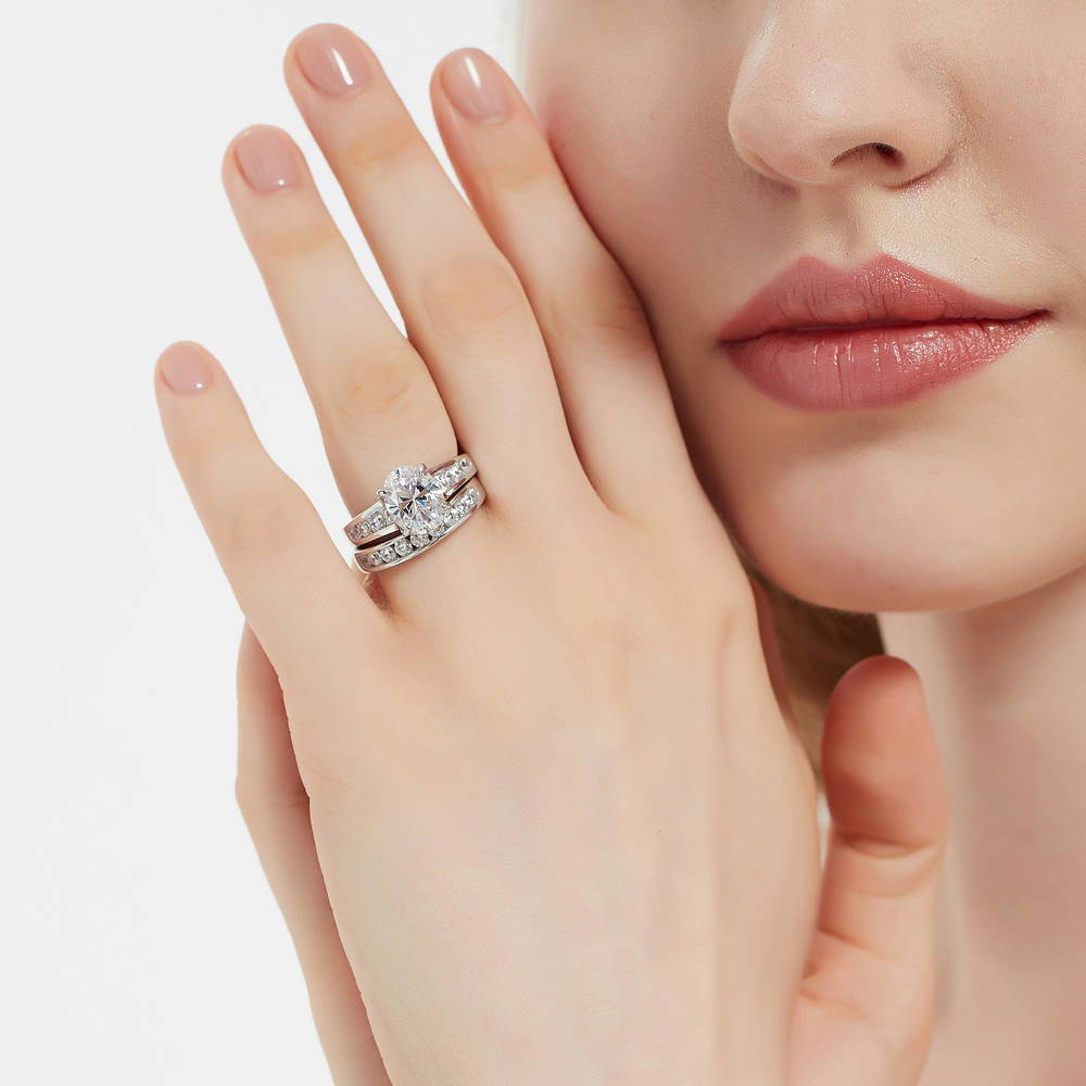 Model wearing Solitaire 2.5ct Oval CZ Ring Set in Sterling Silver