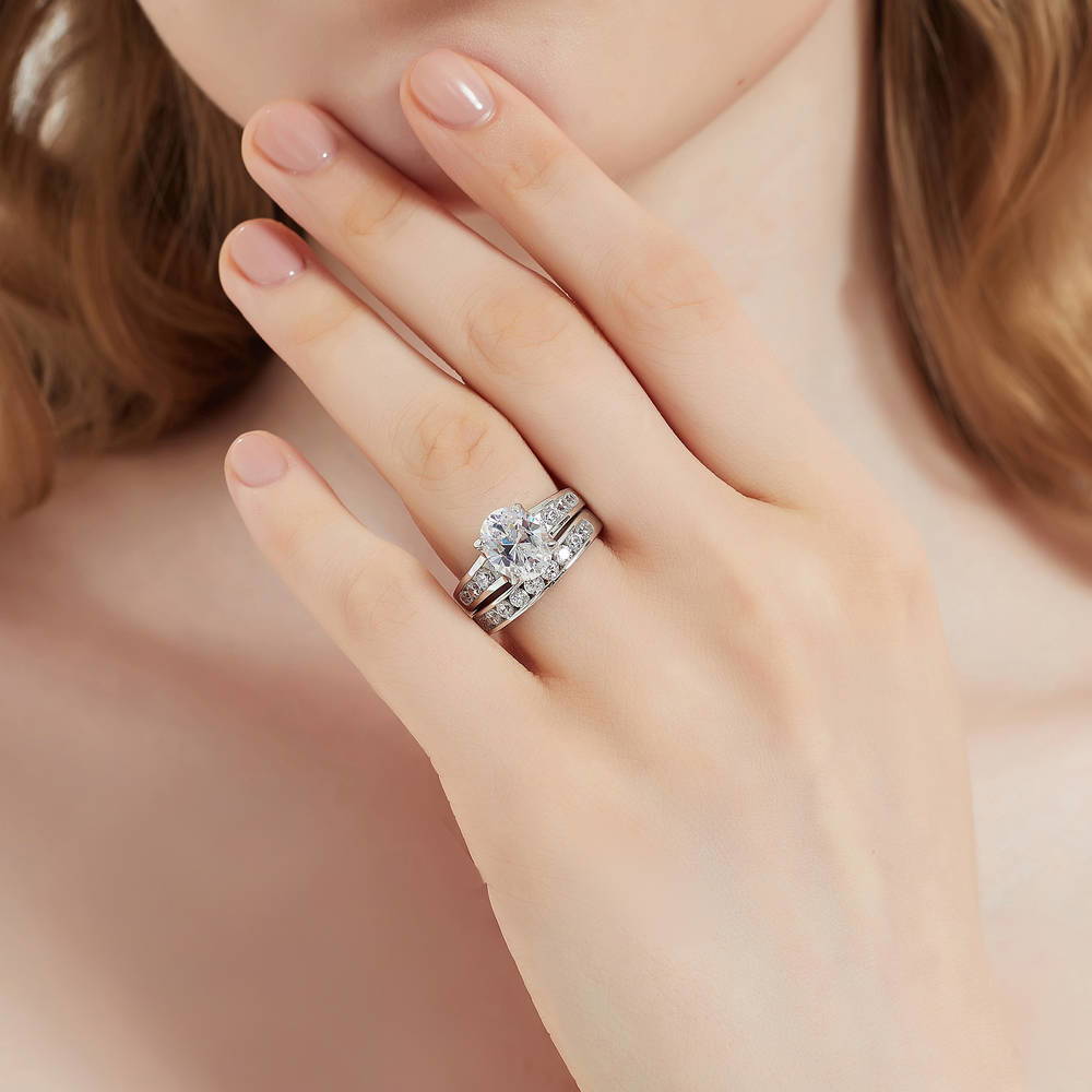 Model wearing Solitaire 2.5ct Oval CZ Ring Set in Sterling Silver