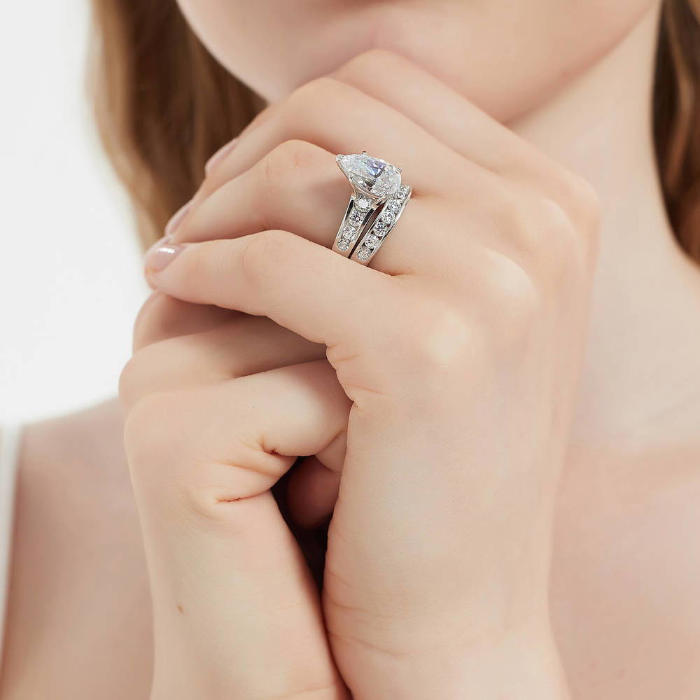 Model wearing Solitaire 3ct Pear CZ Ring Set in Sterling Silver