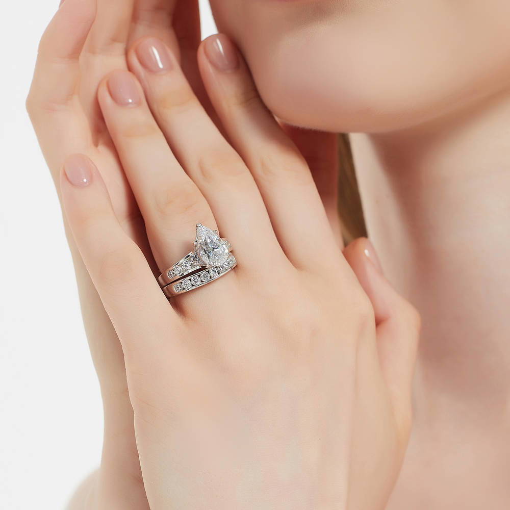 Model wearing Solitaire 3ct Pear CZ Ring Set in Sterling Silver