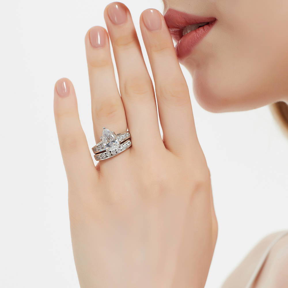 Model wearing Solitaire 3ct Pear CZ Ring Set in Sterling Silver