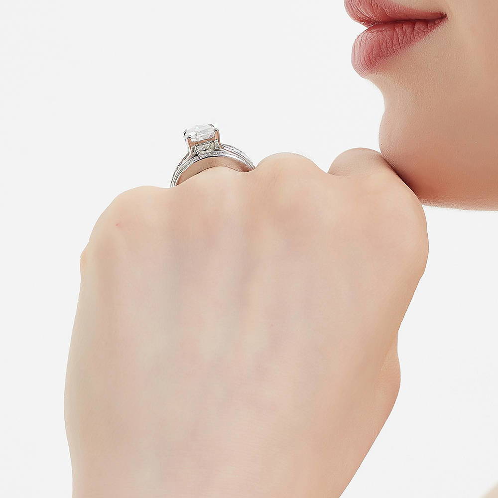 Model wearing Solitaire 3ct Pear CZ Ring Set in Sterling Silver