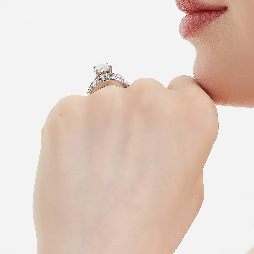 Model wearing Solitaire 3ct Pear CZ Ring Set in Sterling Silver, 7 of 18
