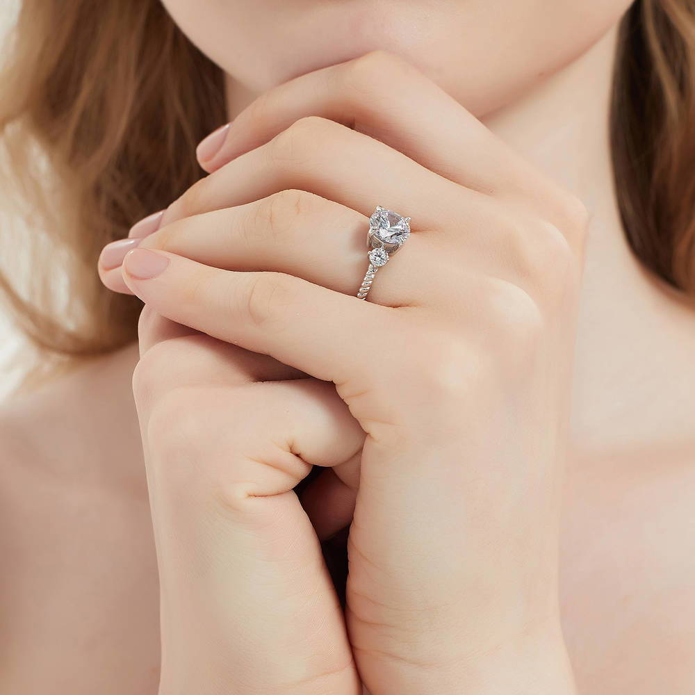 Model wearing 3-Stone Woven Round CZ Ring Set in Sterling Silver