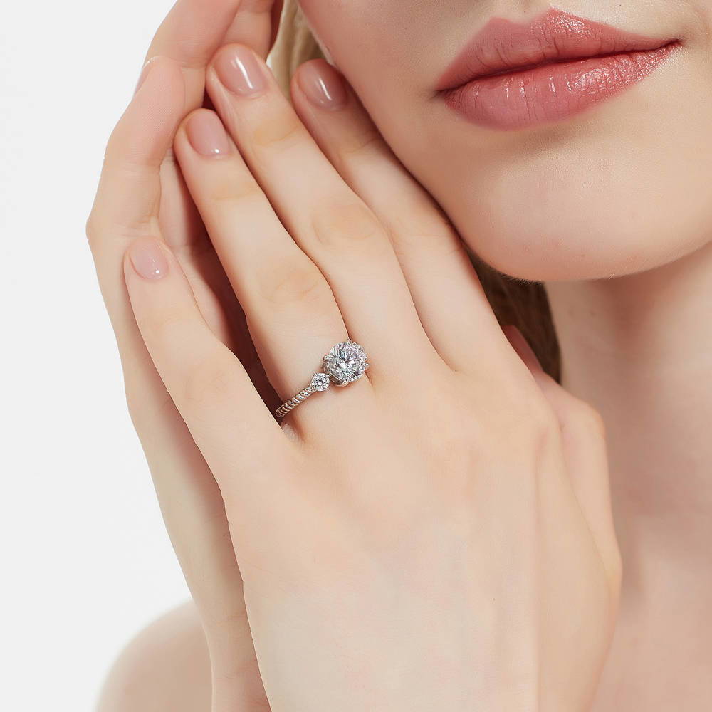 Model wearing 3-Stone Woven Round CZ Ring in Sterling Silver