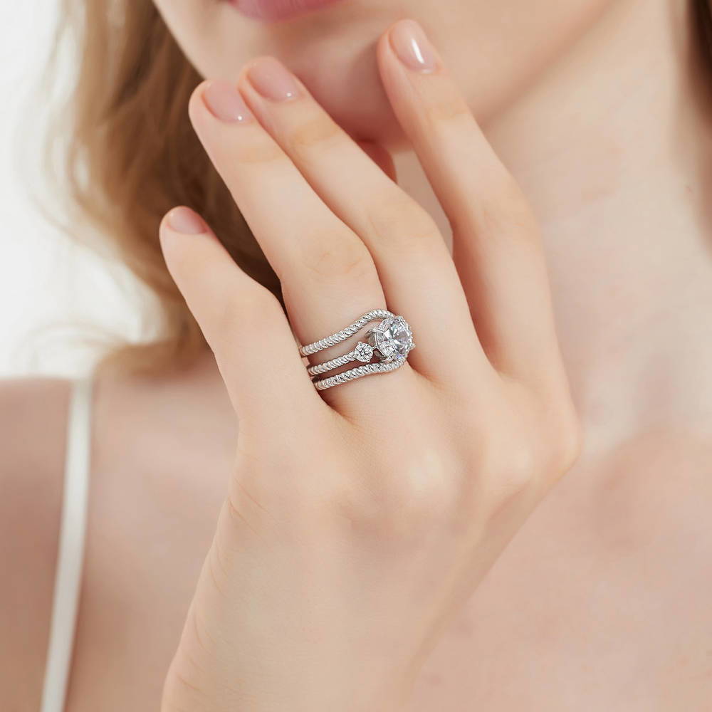 Model wearing 3-Stone Woven Round CZ Ring Set in Sterling Silver