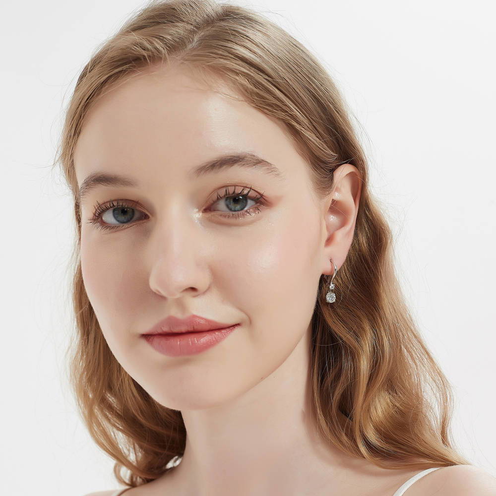 Model wearing Solitaire 1.6ct Round CZ Leverback Dangle Earrings in Sterling Silver