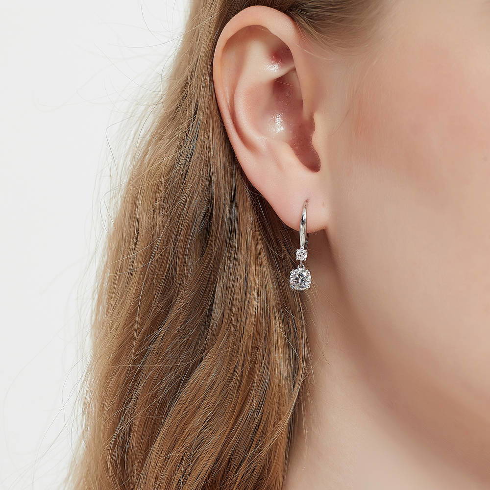 Model wearing Solitaire 1.6ct Round CZ Leverback Dangle Earrings in Sterling Silver