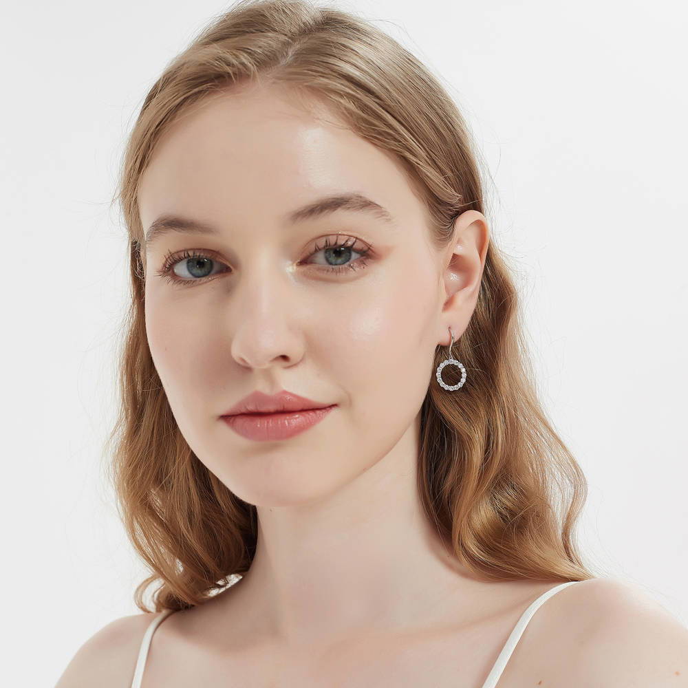 Model wearing Open Circle CZ Fish Hook Dangle Earrings in Sterling Silver