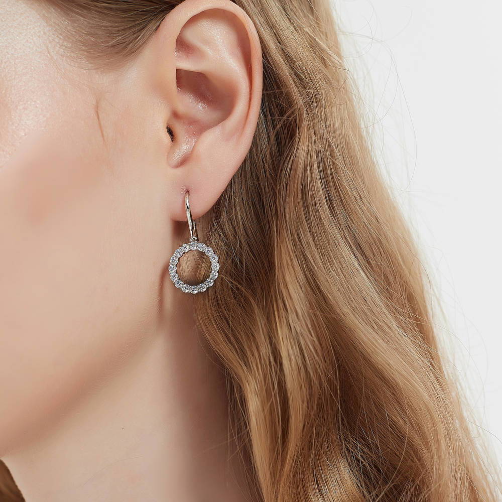 Model wearing Open Circle CZ Fish Hook Dangle Earrings in Sterling Silver