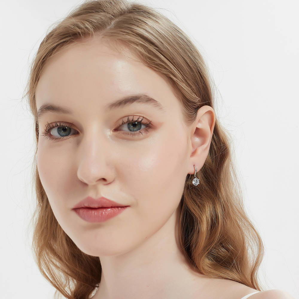 Model wearing Solitaire 2.5ct Round CZ Fish Hook Dangle Earrings in Sterling Silver