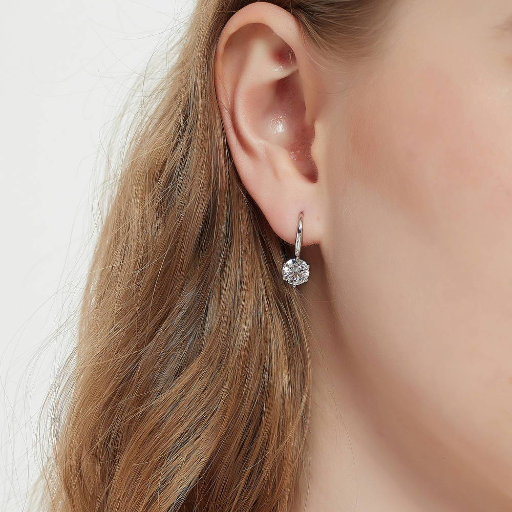 Model wearing Solitaire 2.5ct Round CZ Fish Hook Dangle Earrings in Sterling Silver