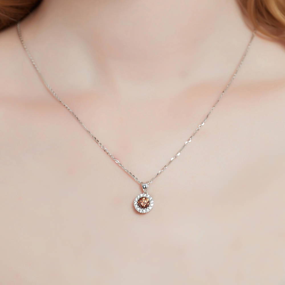 Model wearing Halo Caramel Round CZ Pendant Necklace in Sterling Silver