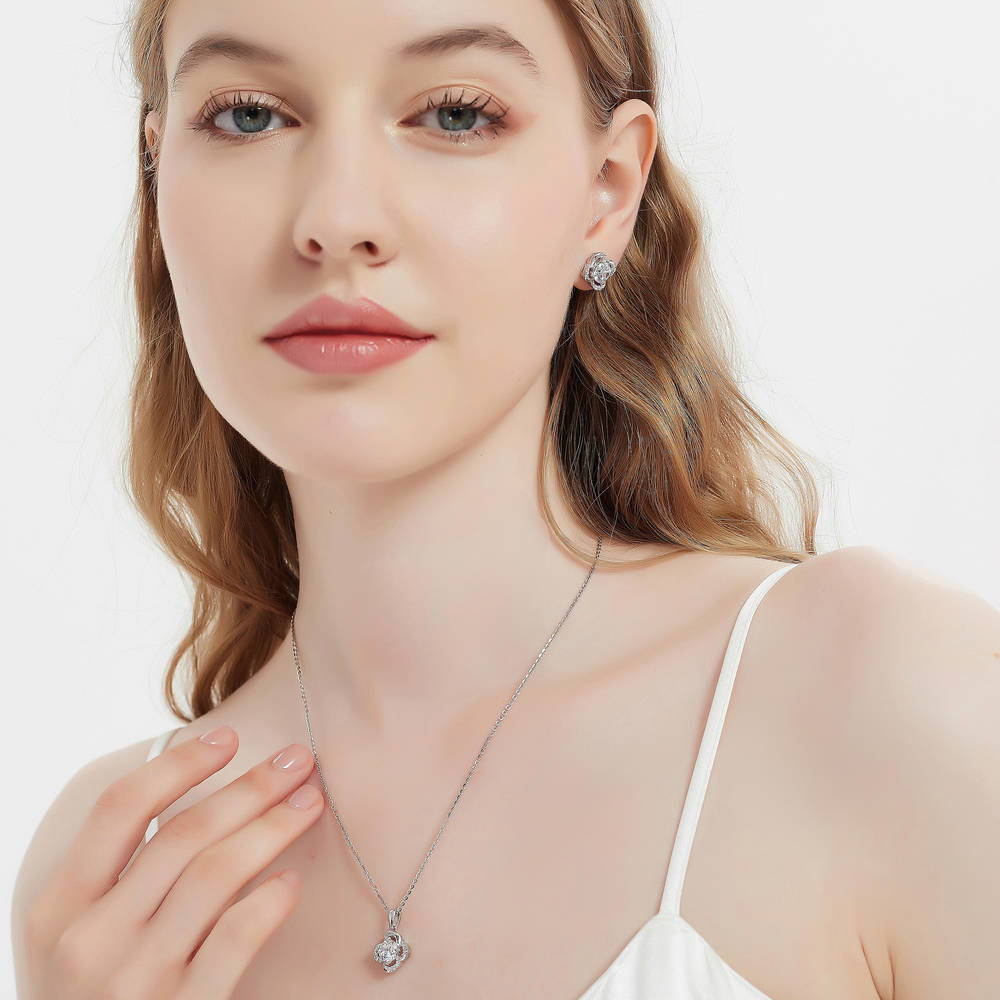 Model wearing Flower CZ Necklace and Earrings Set in Sterling Silver