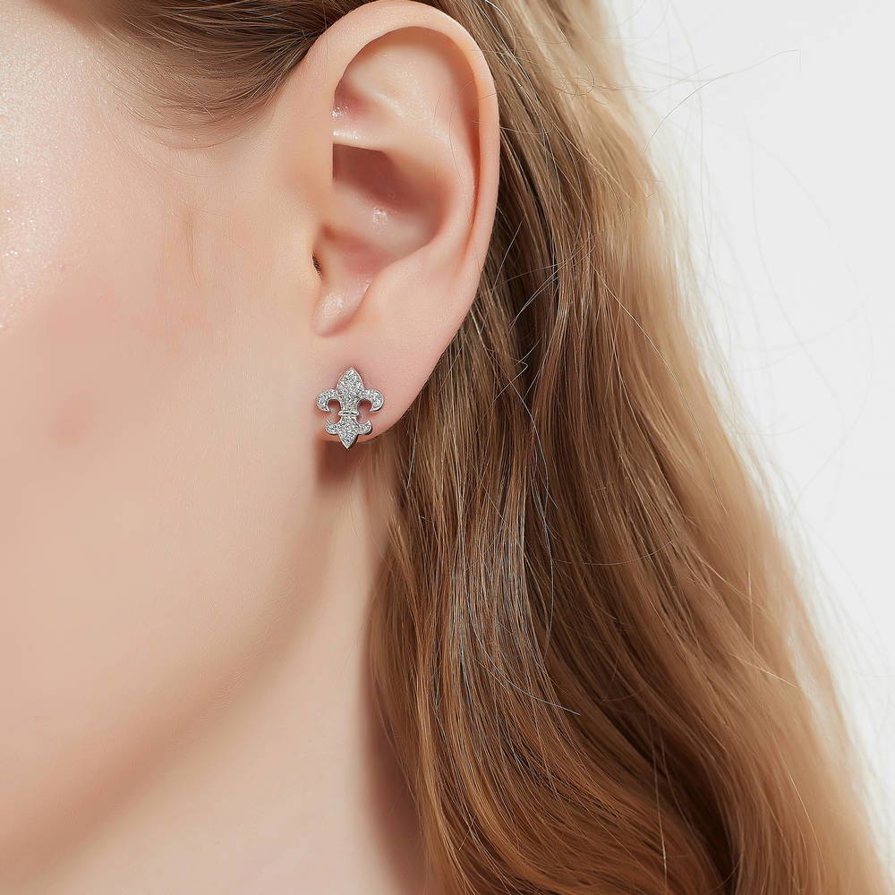 Model wearing Fleur De Lis CZ Necklace and Earrings Set in Sterling Silver