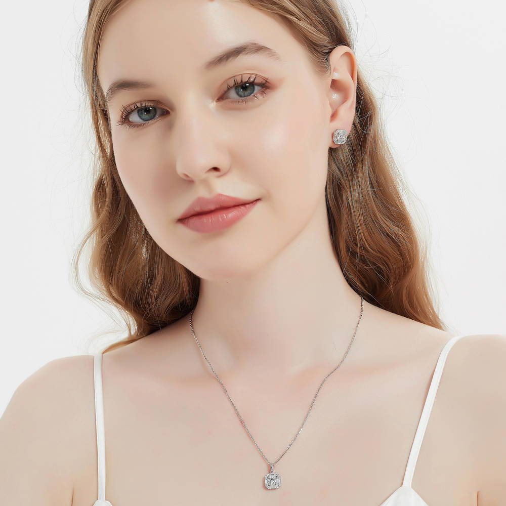 Model wearing Halo Art Deco Round CZ Necklace and Earrings Set in Sterling Silver
